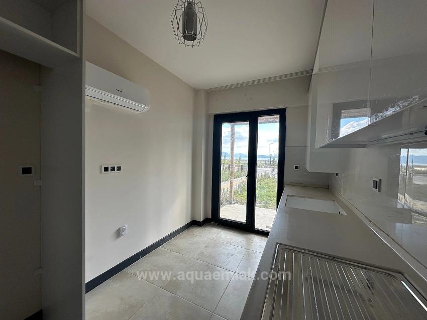 2+1-Zimmer-Wohnung In Köyceğiz Zu Vermieten, Erdgeschoss, Alle Zimmer Klimatisiert, In Einer Wohnanlage Mit Zugangskontrolle.